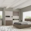 Camera matrimoniale moderna con letto contenitore spatolato e bronzo